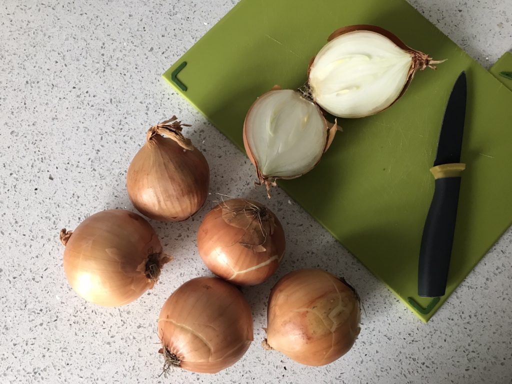 Onions on the chopping board