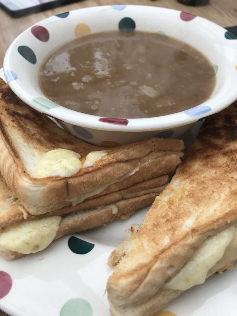 Close up of onion soup with cheese toasties