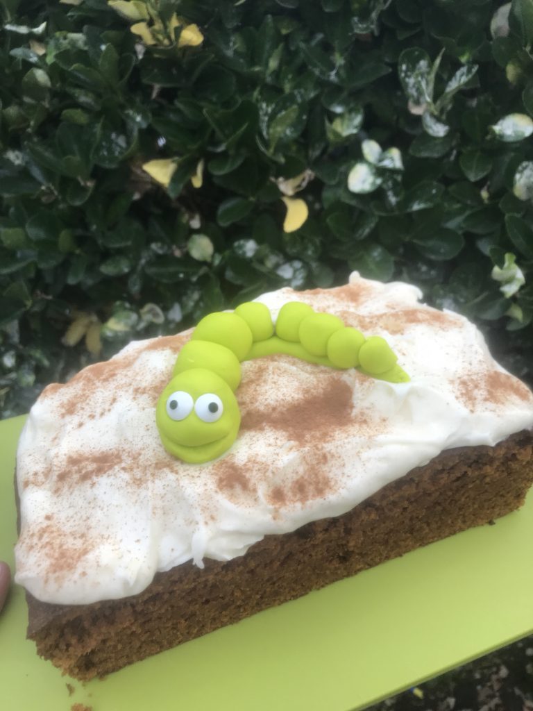 Caterpillar on pumpkin spice latte cake