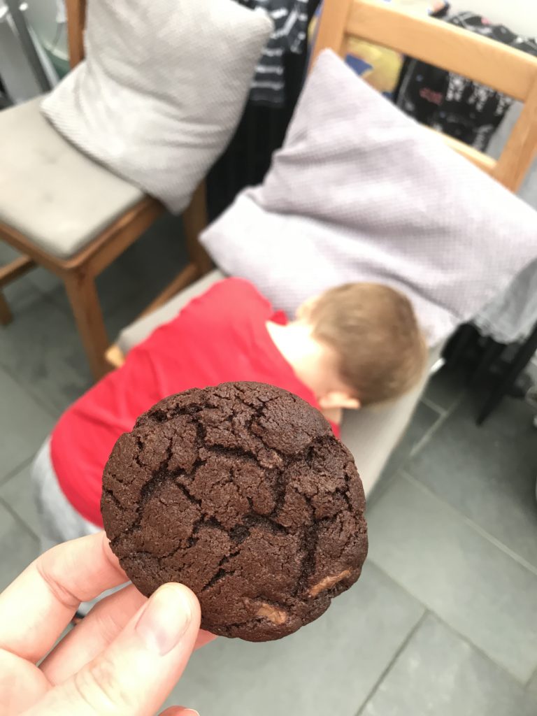Ioan being offered a double chocolate cookie
